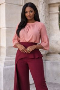 Burgundy pants wedding guest outfit with blush pink blouse