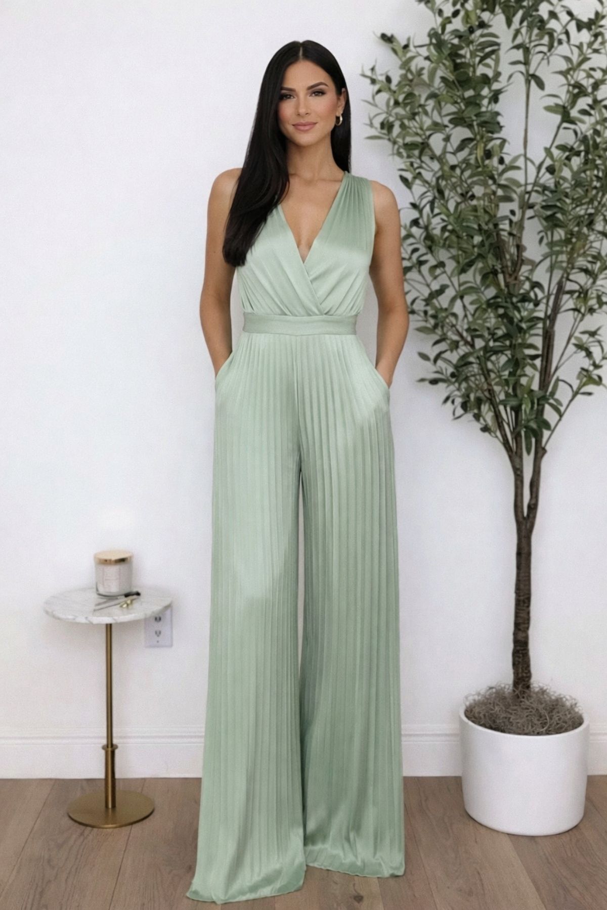Mint green pleated jumpsuit wedding guest outfit with wide-leg pants